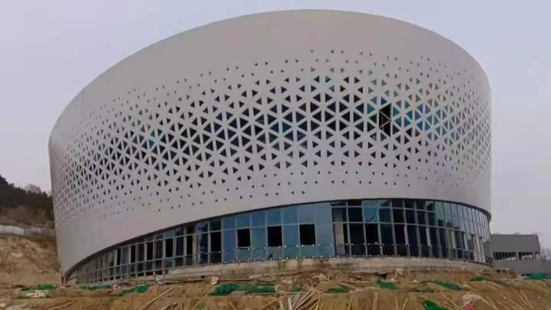 Perforated aluminum panels used as architectural sun shading components, decorative metal sun louver facade for building exterior