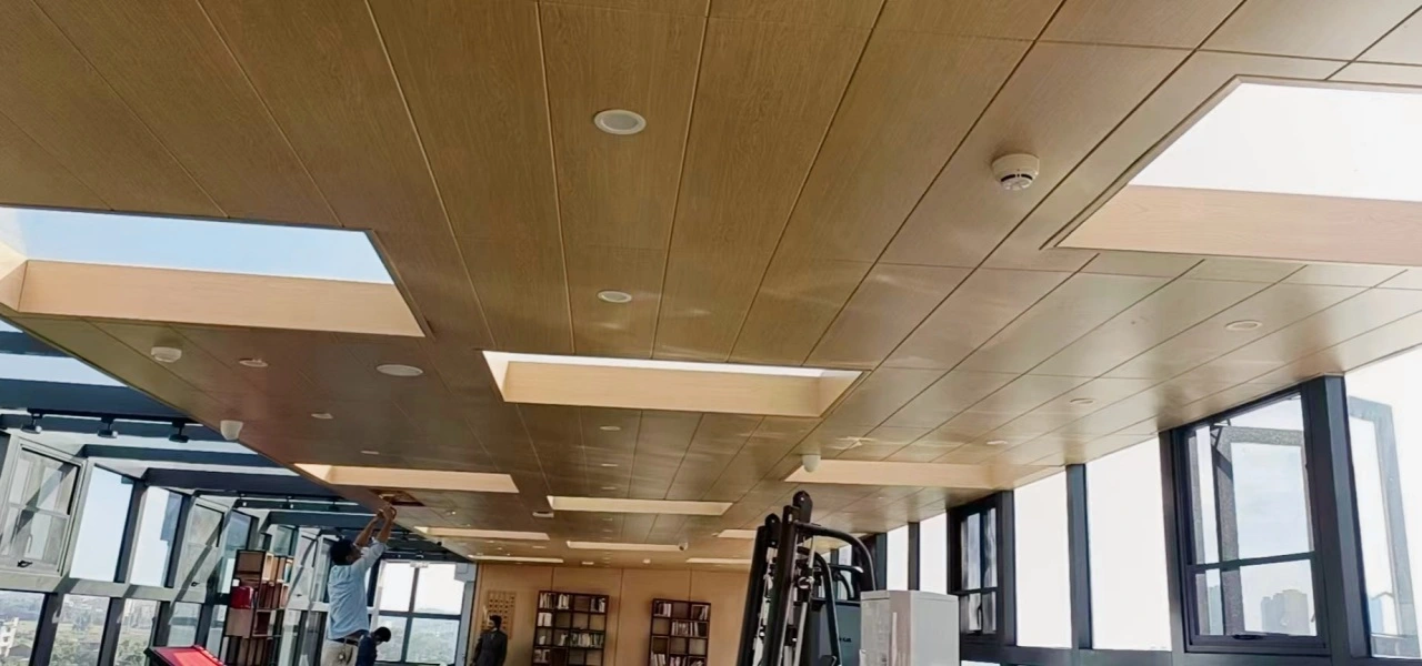 Panoramic view of aluminum ceiling panels in office
