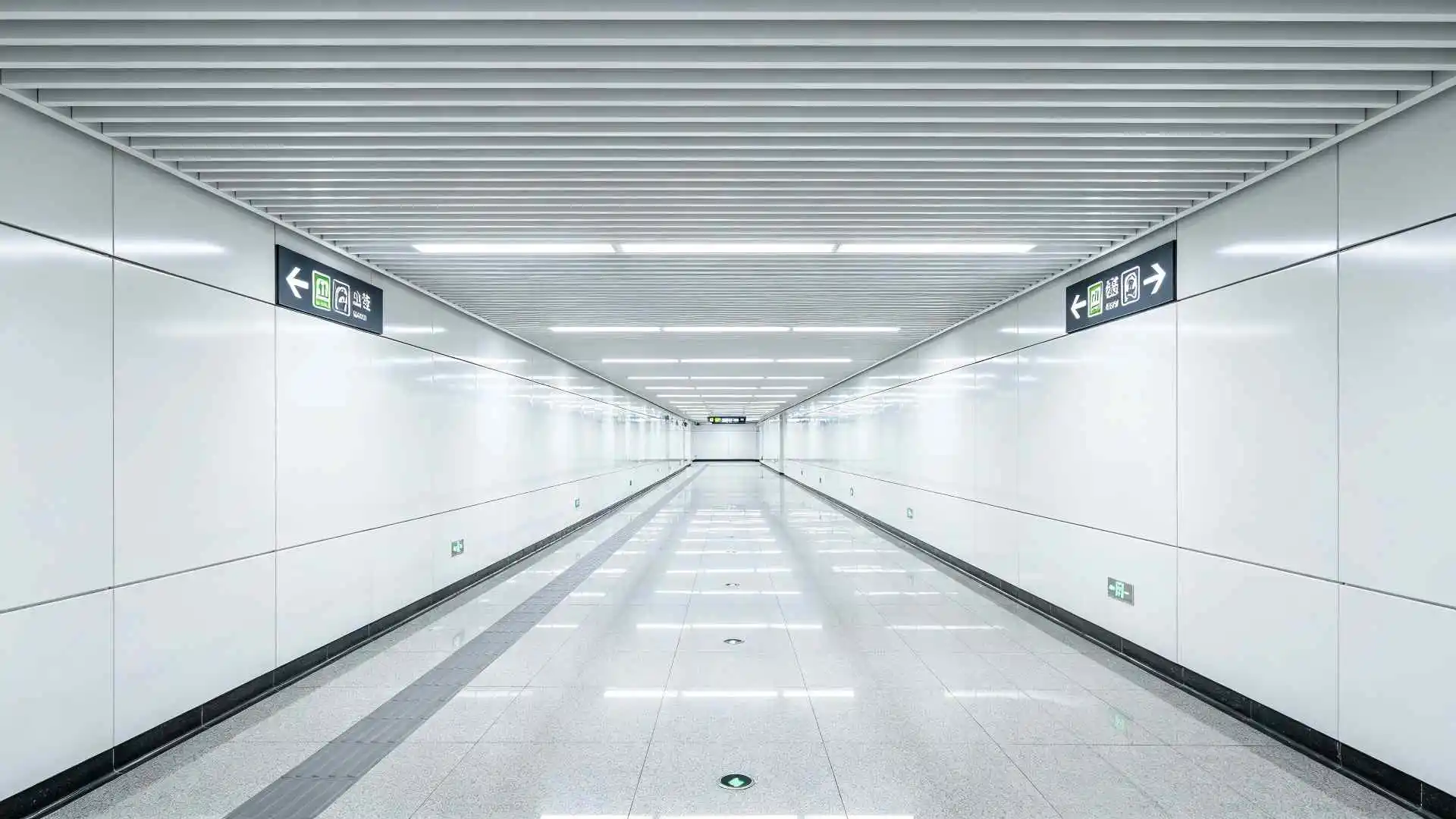 Linear aluminum ceiling for metro transfer corridor, perspective shot Linear aluminum ceiling for metro transfer corridor, perspective shot