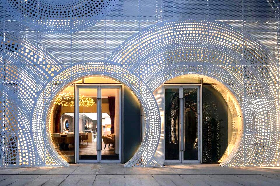 Custom perforated aluminium sheet for business storefront signage with LED light