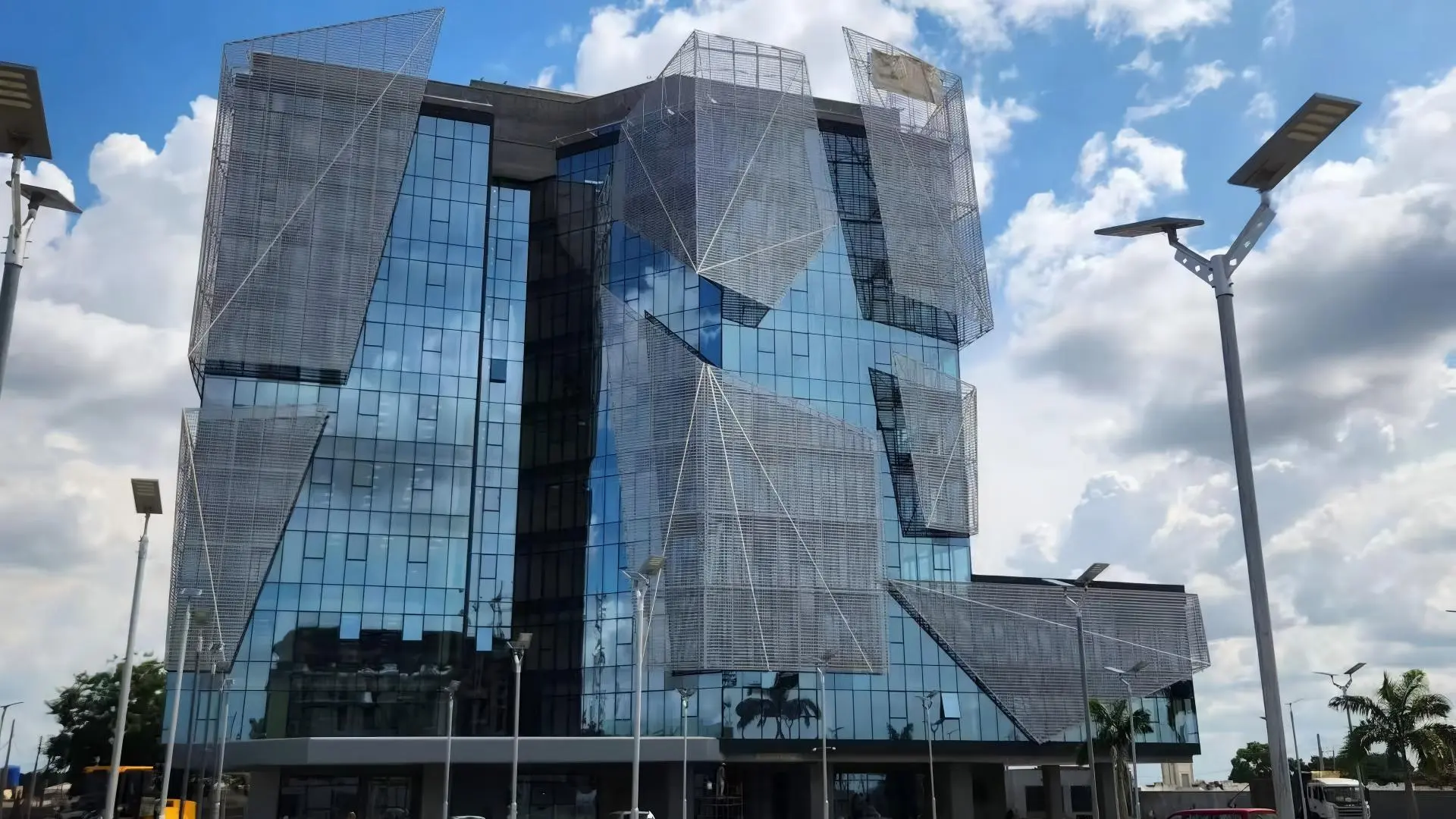 60% open area perforated aluminum sun screen, exterior facade cladding with both sun shading and decorative function, custom hole pattern, PVDF coating for tropical building