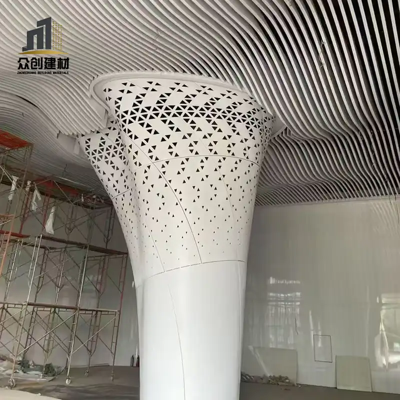 Double‑curved aluminum veneer column cladding
